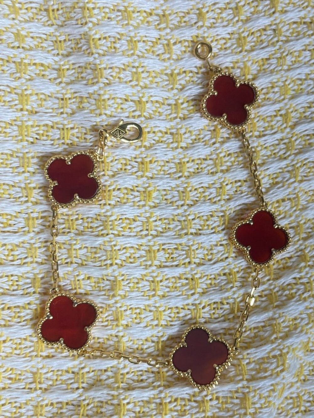 Four‑Leaf Clover Gold Tone Bracelet.